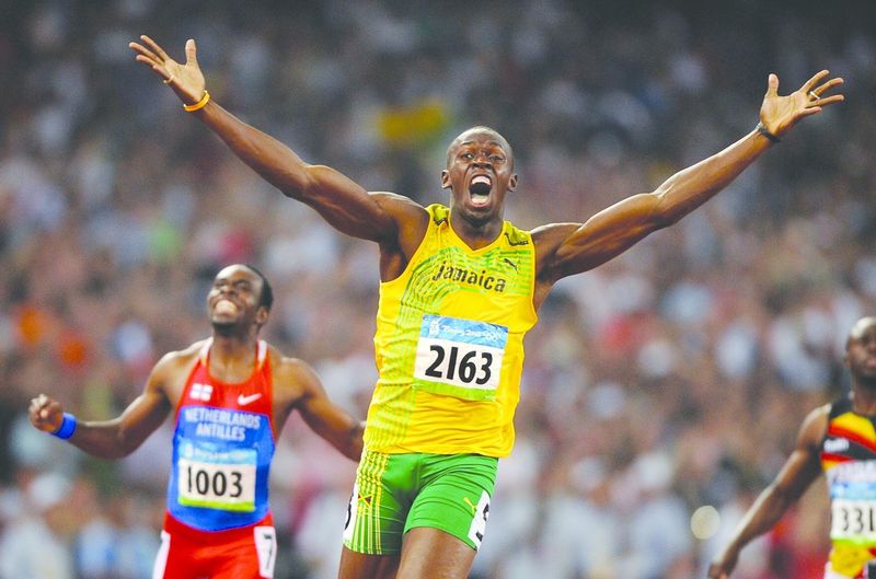 ചിത്രം:Vol5p617 Usain Bolt of Jamaica reacts after breaking the world record with a time of 19.30 to win the gold.jpg